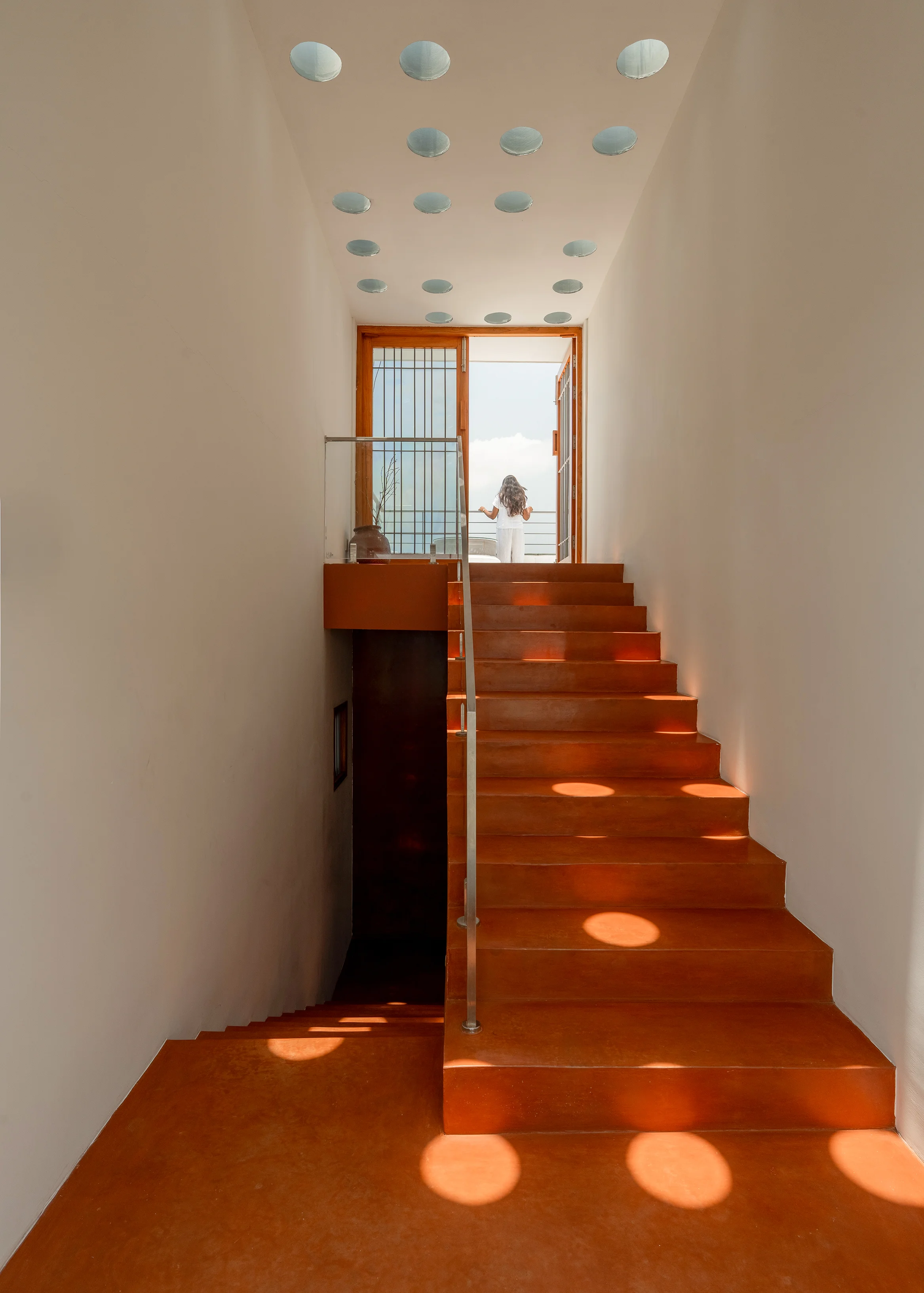 Splitscape Residence skylight staircase with oxide flooring